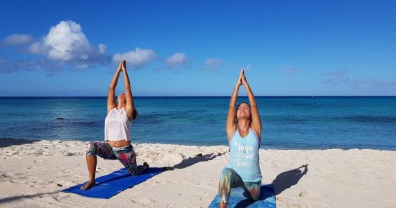 Beginner Yoga Low Lunge Pose (Anjaneyasana) on the Sand